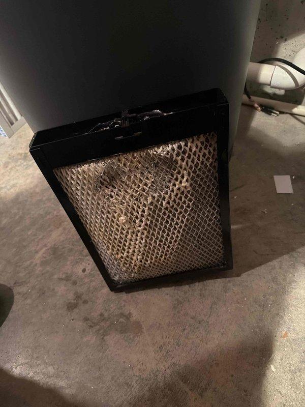Responded to customer complaint of loud furnace noise. Upon inspection, discovered severely clogged air filter causing restricted airflow and system strain. Replaced dirty filter and checked Honeywell humidifier connections, confirming proper operation of the system after service.