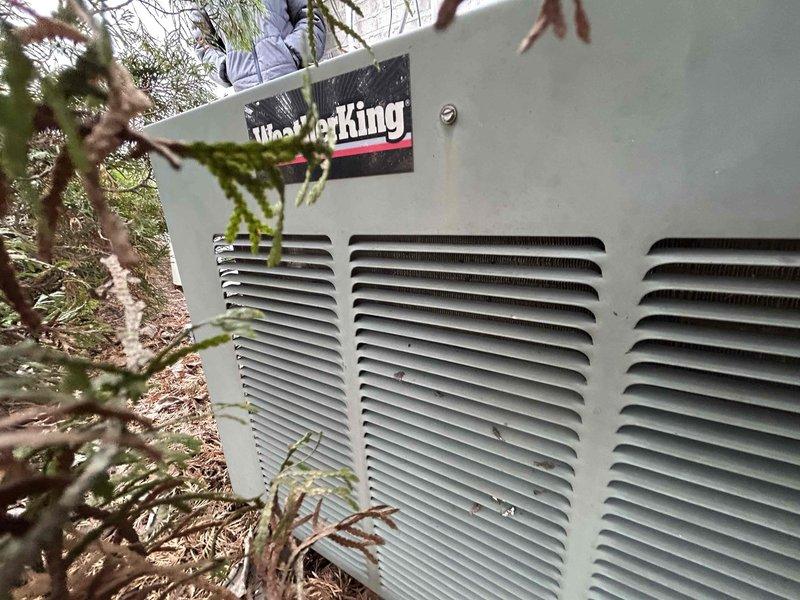 Conducted assessment for replacement of two aging HVAC units for returning customer who had previous installation 5 years ago. Inspected existing WeatherKing outdoor unit showing signs of deterioration with vegetation encroachment around the equipment. Evaluated electrical service panel to ensure adequate capacity for potential new installation, noting current breaker configuration and available spaces for system upgrades.