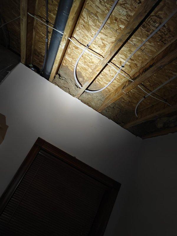 Replaced damaged radiant floor tubing that was compromised during flooring installation. Refilled boiler system, performed comprehensive air bleeding procedure, and conducted full operational testing to verify proper function of the radiant heating system.