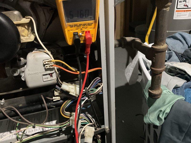 Performed comprehensive HVAC tune-up service for new rental property owner, including electrical system diagnostics with multimeter testing (reading 16.0) on the Honeywell control module. Inspected internal components, wiring connections, and refrigerant lines, and provided customer with contact information for future tenant-related HVAC and water heater service needs.