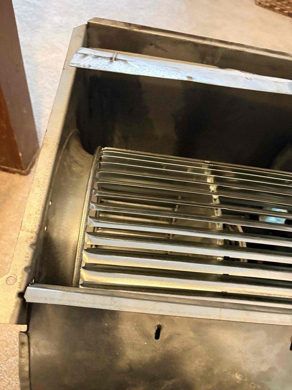 Responded to callback regarding recurring loud noise from blower wheel. Inspected furnace unit, focusing on the metal blower assembly and ventilation components. Identified wear on the blower housing and metal surfaces that was causing the noise issue. Serviced the blower wheel to eliminate the noise complaint.