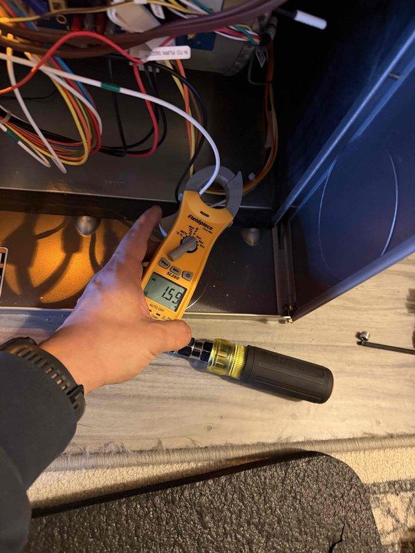 Performed heating maintenance on system and conducted diagnostic testing using digital manometer, which showed pressure reading of 0.04. Electrical testing with clamp meter indicated 15.8 amps during operation. System functioning properly with no issues identified.