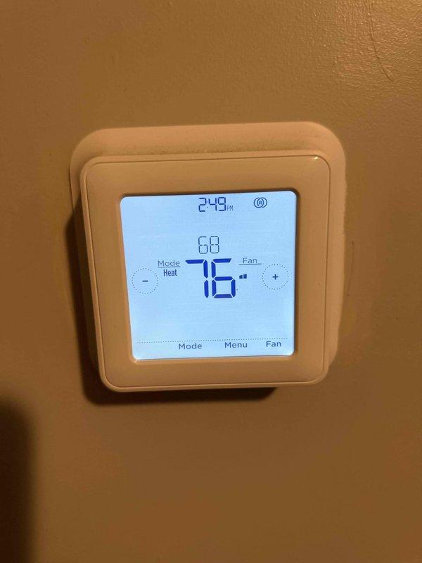 Responded to no-heat complaint in Unit #17. Diagnosed operational thermostat despite tenant report of malfunction. System producing adequate heat with discharge temperature of 105°F. Verified proper thermostat function and confirmed heat delivery to space. Current room temperature 68°F with setpoint at 76°F, indicating system functioning correctly in heating mode.