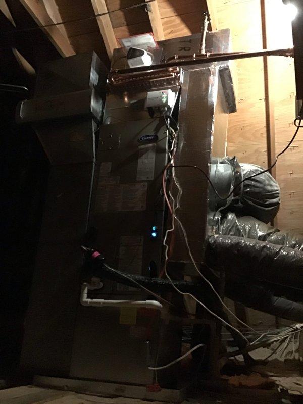 Successfully installed a complete Carrier Infinity system including a 2-ton air handler and A/C unit with hot water coil for heating. Installation included emergency drain pan with float switches, Infinity thermostat, Aprilaire filtration system, and RGF Zero Series II air purifier to provide comprehensive climate control and air quality management.