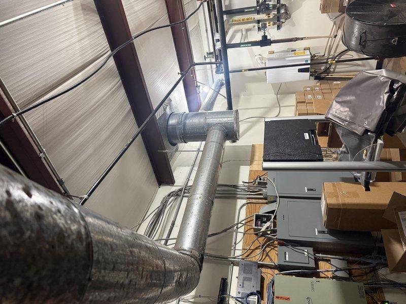 Conducted site assessment of commercial heating system at Safety Kleen facility, examining the existing furnace located in upstairs mechanical room. Evaluated current installation and ductwork configuration to determine replacement options for the 250,000 BTU unit. Customer has received one previous quote and requested comparative estimate for commercial heating equipment replacement.