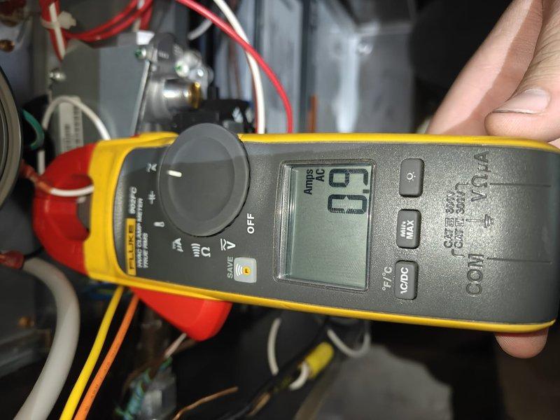 Performed heating system maintenance including inspection of air filter, which showed significant dust accumulation requiring replacement. Conducted electrical diagnostics with clamp meter showing 29 Amps current draw, verifying system is operating within normal parameters.