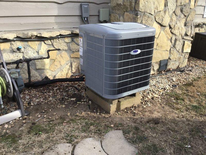 Completed installation of new Carrier Infinity HVAC system including an 80K BTU 97% efficient modulating gas furnace and 3-ton AC unit with Infinity Wall control. Installation included new pad, disconnect, copper line-set, drain line, PVC exhaust/intake, Aprilaire filtration assembly, 720M powered humidifier, and duct cleaning. Properly capped off old flue and positioned outdoor condenser unit on stone base against exterior wall.