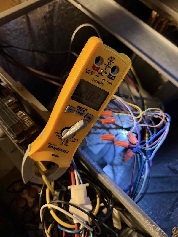 Diagnosed no-heat complaint in aging furnace system. Performed voltage testing at control board and verified proper voltage readings of 20.2V, indicating functional electrical supply. Inspected wiring connections at terminal blocks and found all connections secure with no signs of damage or corrosion.