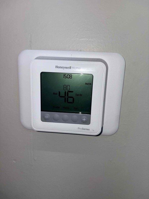 Responded to no heat complaint on commercial RTU. Diagnostic check revealed significant temperature differential between thermostat setpoint (80°F) and actual space temperature (46°F). Verified thermostat was properly calling for heat with system in heating mode and fan running. Completed necessary repairs to restore heating function to the unit.