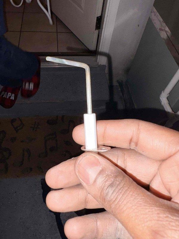 Responded to no-heat emergency call for tenant. Diagnosed furnace issue and found faulty flame sensor. Removed and replaced the defective plastic retainer component, restoring proper flame detection. System is now operational and heating effectively.