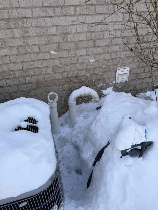 Diagnosed no-heat issue on gas furnace system that was repeatedly shutting off. Discovered outdoor unit and PVC exhaust venting were obstructed by heavy snow accumulation, preventing proper combustion air intake and exhaust. Cleared snow from outdoor components and verified system operation restored to normal.