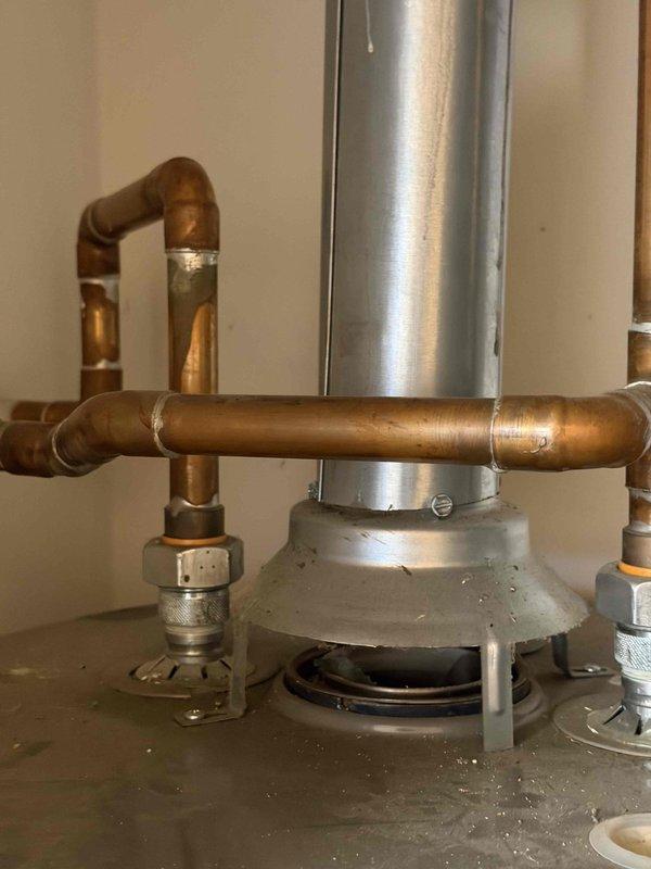 Performed annual heating maintenance service on customer's system. Conducted temperature readings with Fieldpiece SC260 multimeter, verifying proper operation at 32°C. Inspected exhaust venting and copper water line connections for integrity and proper installation, with all components functioning as designed.