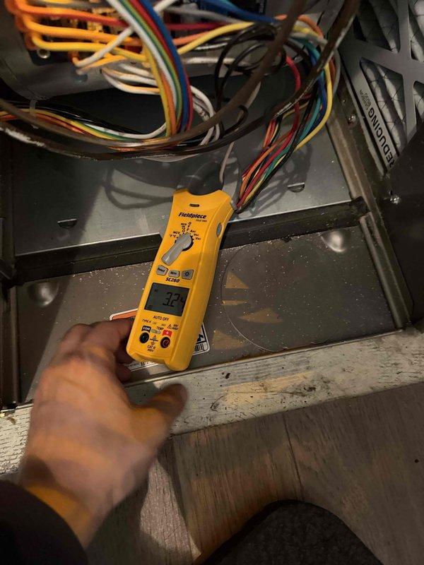 Performed annual heating maintenance service on customer's system. Conducted temperature readings with Fieldpiece SC260 multimeter, verifying proper operation at 32°C. Inspected exhaust venting and copper water line connections for integrity and proper installation, with all components functioning as designed.