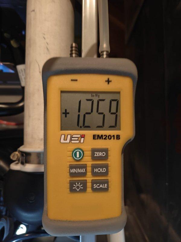 Performed comprehensive heating system maintenance and conducted static pressure testing using a UEi EM201B meter, with readings of +125.9 In/Wg and -33.19 In-WG recorded for system diagnostics. Noted that customer's service plan has expired and requires renewal for the upcoming cooling and heating seasons.