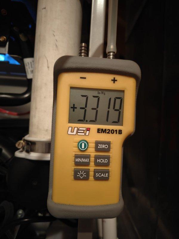 Performed comprehensive heating system maintenance and conducted static pressure testing using a UEi EM201B meter, with readings of +125.9 In/Wg and -33.19 In-WG recorded for system diagnostics. Noted that customer's service plan has expired and requires renewal for the upcoming cooling and heating seasons.