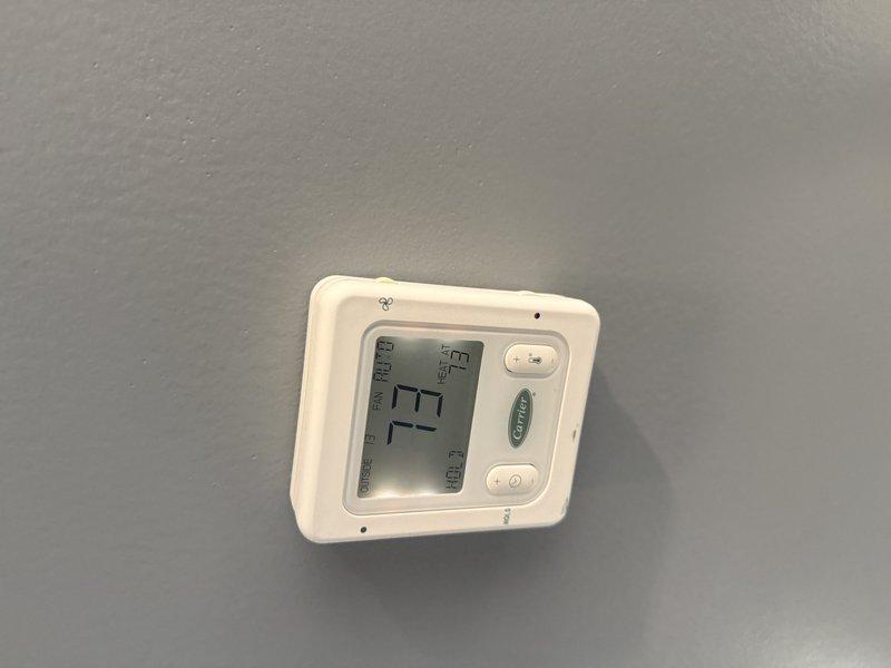 Conducted an on-site evaluation for potential installation of multiple steam humidifiers across existing HVAC systems. Inspected current thermostat configuration and examined mechanical installation space including PVC piping and flexible conduit that would accommodate humidifier integration. Assessment completed per customer's request to address indoor air quality concerns.