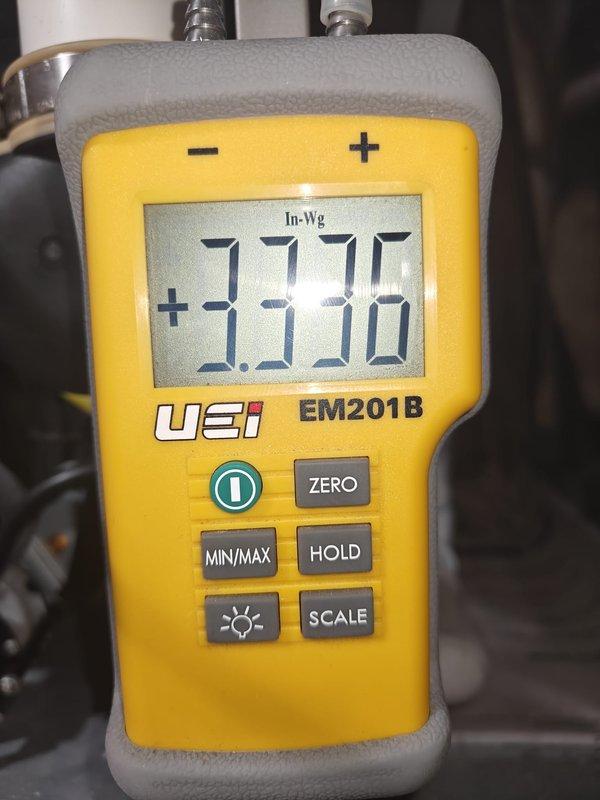 Performed monthly heating maintenance on system. Conducted electrical testing with Fluke 902FC clamp meter, measuring resistance at 56.7 ohms. Checked system pressure using UEI EM201B, which displayed 3.336 In-Wg, confirming proper operation within specifications.