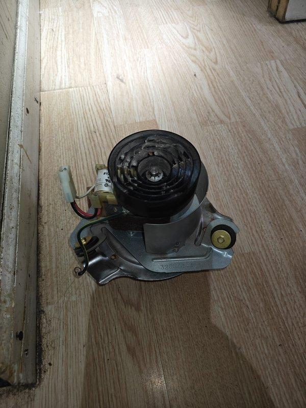 Responded to no heat call at customer's residence. Diagnosed failed inducer motor as evidenced by low amperage reading of 0.3 Amps AC on Fluke 902FC meter. Removed and replaced inducer motor assembly, then verified proper system operation before completing service.