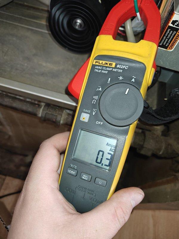 Responded to no heat call at customer's residence. Diagnosed failed inducer motor as evidenced by low amperage reading of 0.3 Amps AC on Fluke 902FC meter. Removed and replaced inducer motor assembly, then verified proper system operation before completing service.