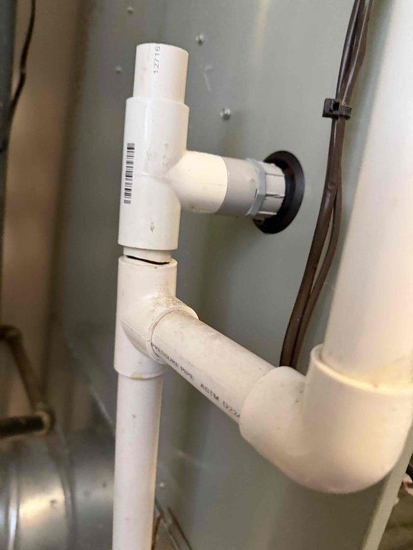 Responded to service call regarding water leakage from condensation trap. Inspected PVC condensate drain system and found steady leak affecting furnace operation. Customer had been managing the issue by cleaning up water as needed. Resolved the drainage issue to restore proper furnace function.