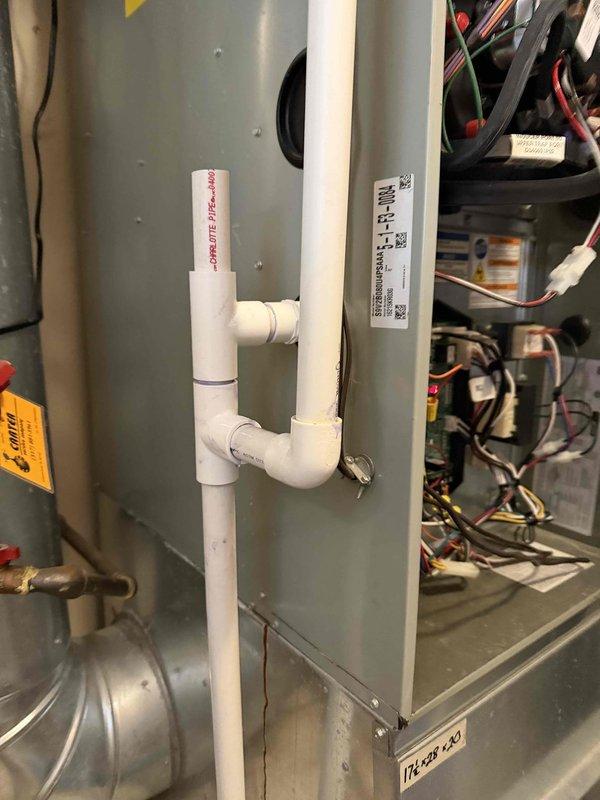 Responded to service call regarding water leakage from condensation trap. Inspected PVC condensate drain system and found steady leak affecting furnace operation. Customer had been managing the issue by cleaning up water as needed. Resolved the drainage issue to restore proper furnace function.