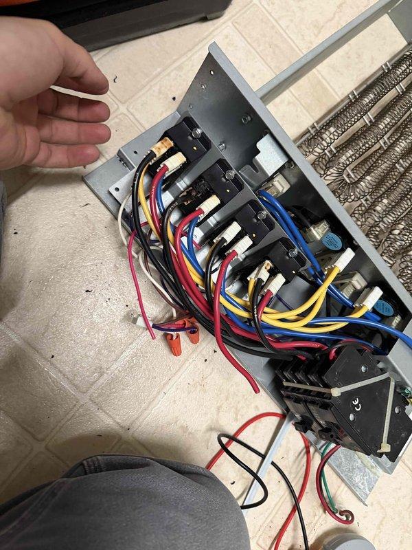 Responded to customer concern of furnace emitting hot smell. Conducted diagnostic inspection of electrical components, examining wiring connections at terminal blocks and relay assembly. All electrical connections were found intact with proper installation; no damage observed to components or wiring insulation despite minor wear.