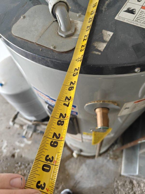 Performed inspection of American water heater leaking from bottom. Documented measurements of existing 52-62" tall unit to provide accurate replacement estimate. Customer requires new water heater installation due to tank failure.