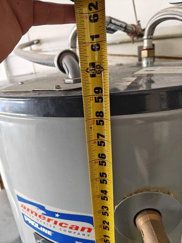 Performed inspection of American water heater leaking from bottom. Documented measurements of existing 52-62" tall unit to provide accurate replacement estimate. Customer requires new water heater installation due to tank failure.