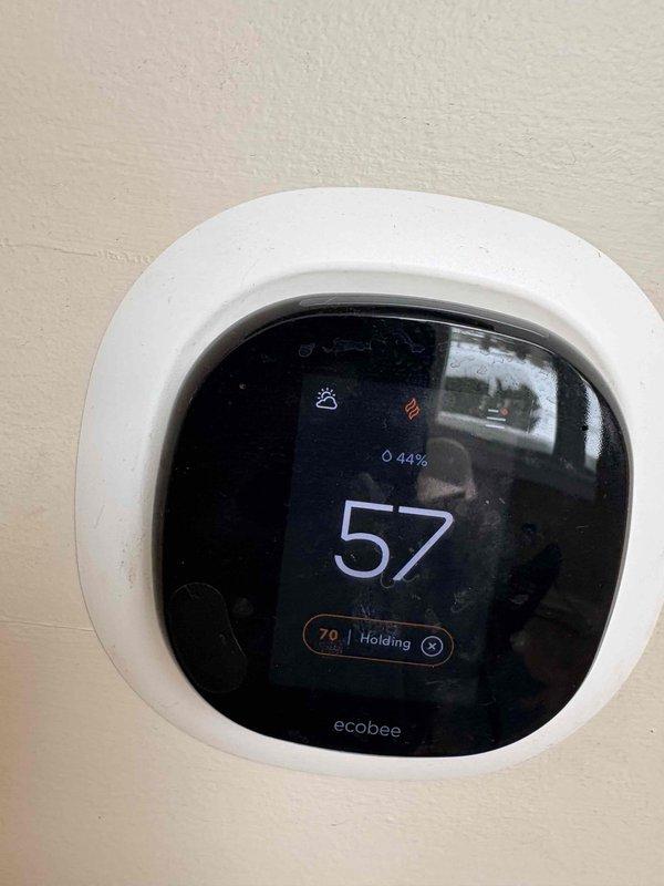 Responded to no heat call and found system showing 52.8°F at the furnace. Verified ecobee thermostat was only reading 57°F while set to hold at 70°F with 44% battery remaining. Diagnosed and repaired heating system, restoring proper operation.