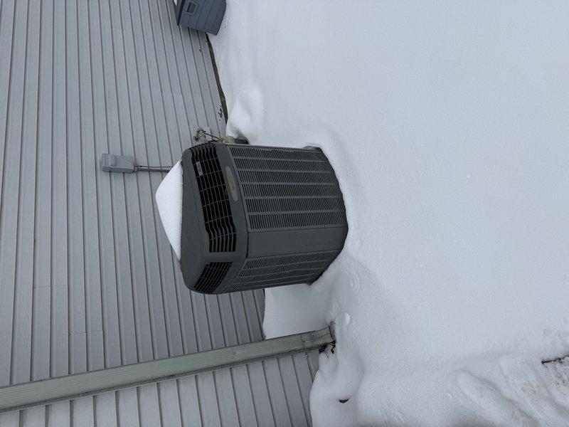 Performed site assessment for full system replacement following prior repair quote. Existing outdoor unit shows significant age with snow accumulation affecting performance. Current installation on deck requires evaluation for proper replacement positioning. Recommended complete HVAC system replacement due to condition of equipment and potential efficiency concerns.