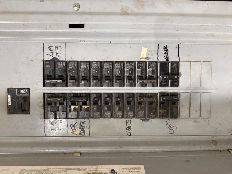 Conducted estimate for replacement of HVAC system at Ben's Garage for Ricky Singh (765-484-3200). Inspected existing electrical panels to evaluate capacity for new equipment installation. Both panels show adequate capacity with multiple circuit breakers available, including a 200A main breaker that would support proposed replacement system.