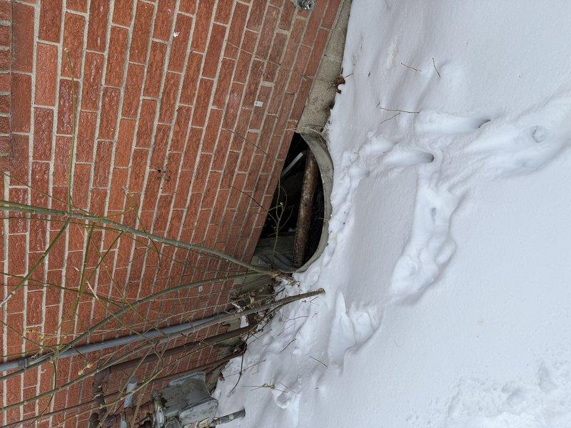 Performed estimate for replacement of a double unit HVAC system. Current outdoor condenser unit is covered in snow and shows signs of age/exposure. Foundation area inspection revealed potential drainage concerns that would need to be addressed during system replacement.