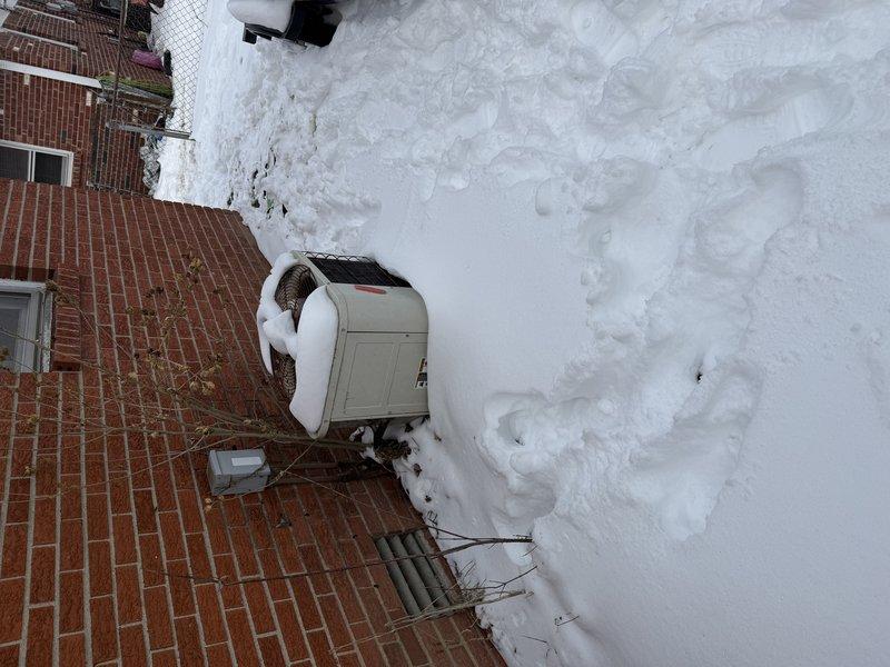 Performed estimate for replacement of a double unit HVAC system. Current outdoor condenser unit is covered in snow and shows signs of age/exposure. Foundation area inspection revealed potential drainage concerns that would need to be addressed during system replacement.
