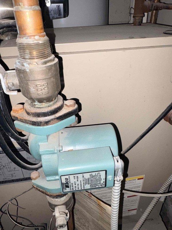 Performed routine heating maintenance on boiler system. Inspected Amtrol expansion tank and associated copper piping connections for proper operation and pressure. Examined circulation pump for functionality, noting minor mineral buildup at brass valve connection points that did not affect performance.