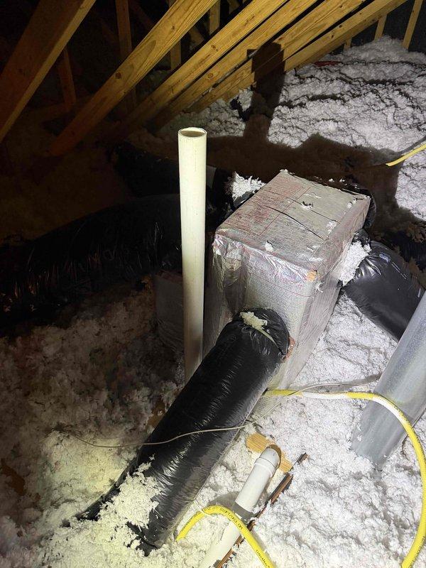 Performed comprehensive inspection of heating system in response to customer concerns about poor air quality and possible CO2 issues. Examined attic-installed equipment with particular attention to venting components, including PVC exhaust pipe and ductwork connections. Verified proper duct sizing and connection integrity with measurements. No evidence of venting issues or carbon monoxide leakage was detected, confirming findings from previous service visit.