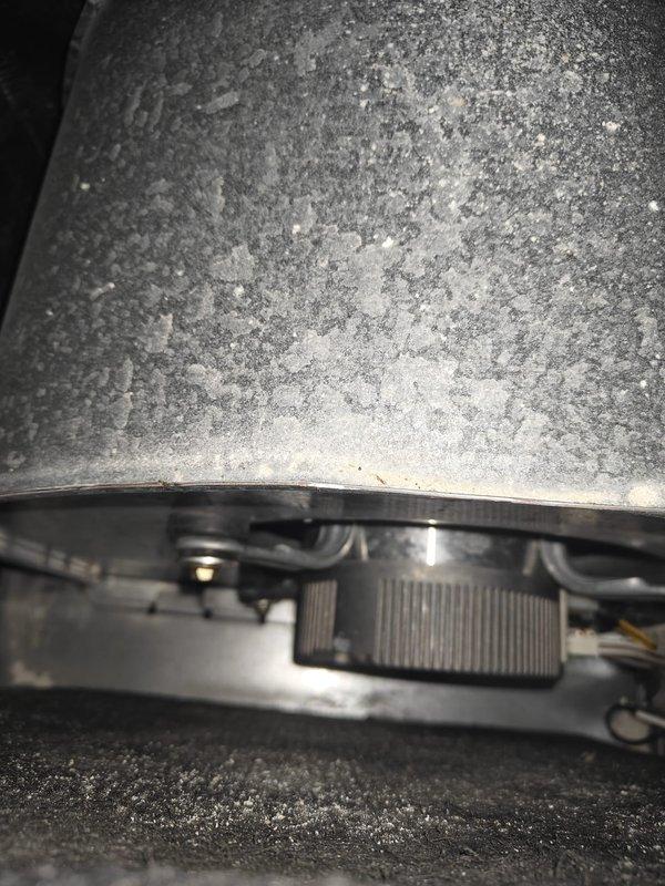 Performed complimentary AC tune-up service as part of contract fulfillment. Conducted voltage testing with multimeter, measuring 2.2 DC volts on system components. Identified and documented significant dust accumulation on equipment requiring cleaning to ensure optimal system performance.