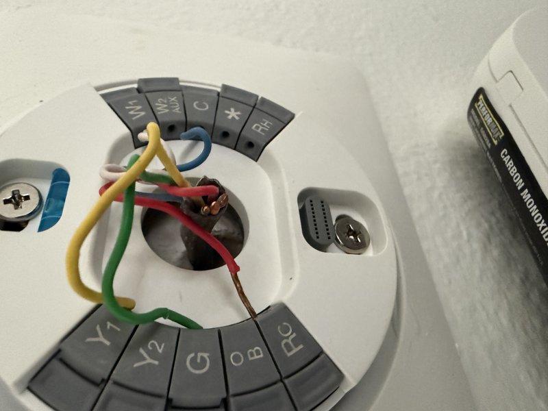 Conducted an estimate for complete HVAC system replacement. Inspected existing wall-mounted thermostat wiring configuration and evaluated current system installation including ductwork and air return placement. Documented interior access panel location for future installation planning.