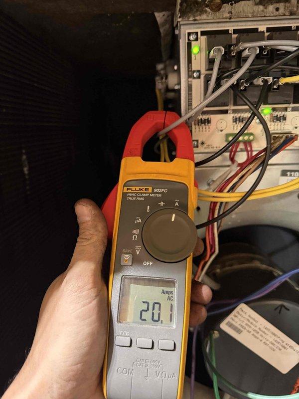 Performed diagnostic testing on geothermal system, measuring 20.1 Amps AC with Fluke 902FC clamp meter. Identified significant corrosion and deterioration on electrical connection panel with multiple fuses/breakers. Completed quoted repairs to address deteriorated wiring connections and electrical components showing signs of heat damage.