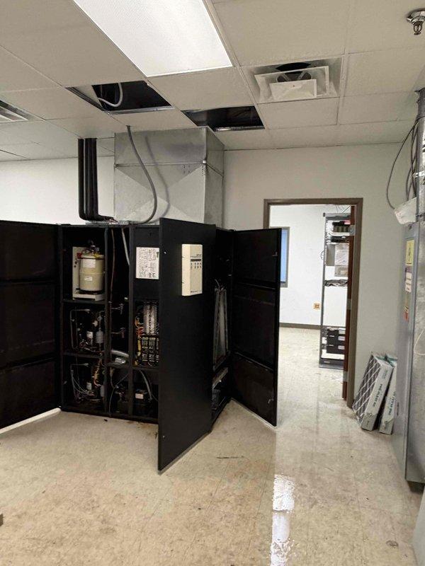 Responded to no heat complaint in server room. Investigated RTU that was leaking into the space, which required accessing the unit through ceiling panels. Diagnostic revealed issues with the HVAC system affecting both temperature control and causing water intrusion. Completed initial assessment and documented conditions with before/after photos as required.