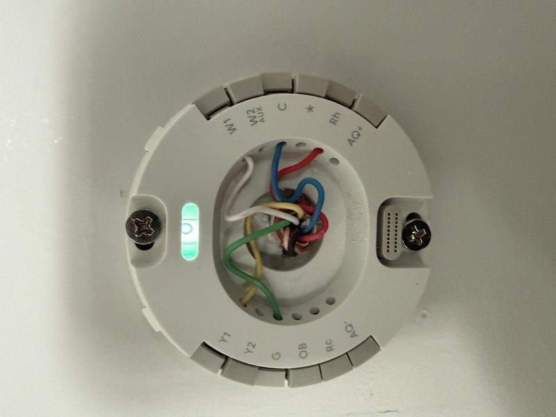 Performed inspection of dual zone HVAC system with focus on wiring connections. Examined thermostat wiring configuration, noting proper terminal connections (W2, C, RH, Y1, Y2, G, OB, RC) with corresponding color-coded wires. Verified all connections were secure and properly terminated at both the control board and thermostat.