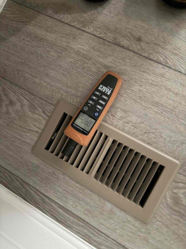 Performed scheduled heating maintenance service on dual systems. Conducted airflow testing at floor registers with readings of approximately 1100 CFM and electrical diagnostics using a Fieldpiece meter that showed 222V to verify proper system voltage. Both systems functioning within manufacturer specifications after service.