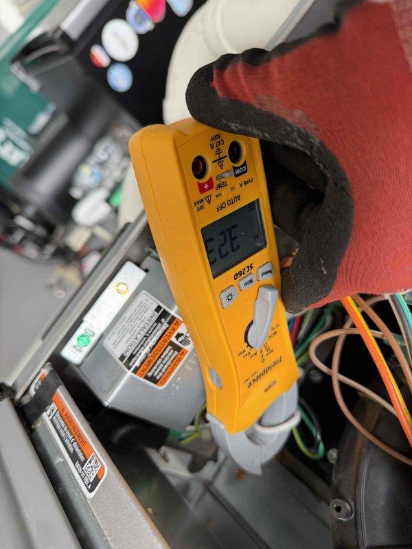 Performed scheduled heating maintenance service on dual systems. Conducted airflow testing at floor registers with readings of approximately 1100 CFM and electrical diagnostics using a Fieldpiece meter that showed 222V to verify proper system voltage. Both systems functioning within manufacturer specifications after service.
