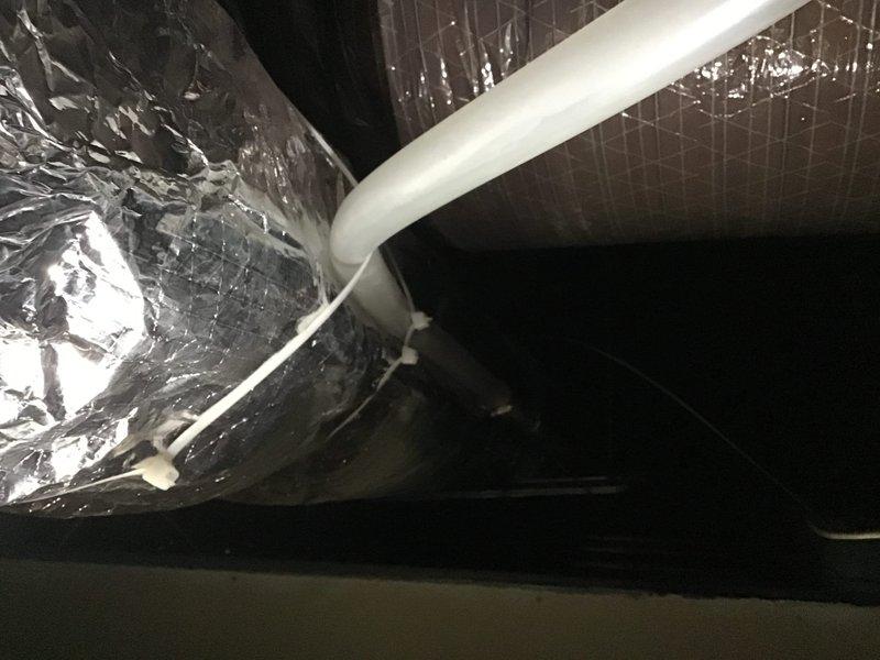 Responded to callback regarding discharge line filled with water. Inspected HVAC ductwork and drainage system. Found water accumulation in the discharge line, cleared obstruction, and verified proper drainage functionality. System now operating correctly with no water backup issues.