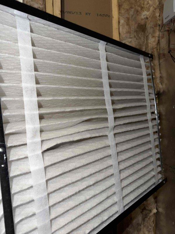 Completed initial heating maintenance service for the season. Inspected and confirmed proper installation of pleated air filter in the furnace system. Examined ductwork and insulation, noting proper installation of reflective foil insulation and ventilation components.