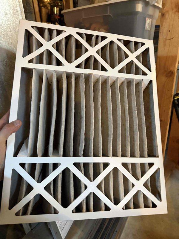 Performed annual heating system maintenance including voltage testing (reading 22.9V) and inspection of filter. Verified electrical connections and safety controls were functioning properly. Replaced air filter which showed normal accumulation of dust and debris.