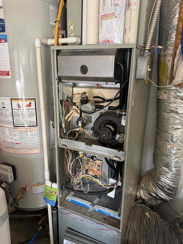 Performed diagnostic inspection on 18-year-old Trane furnace after report of potential crack in heat exchanger. Utilized borescope camera to conduct thorough examination of internal components, confirming presence of heat exchanger damage. Discussed repair options with customer and family member regarding unit's age and condition.