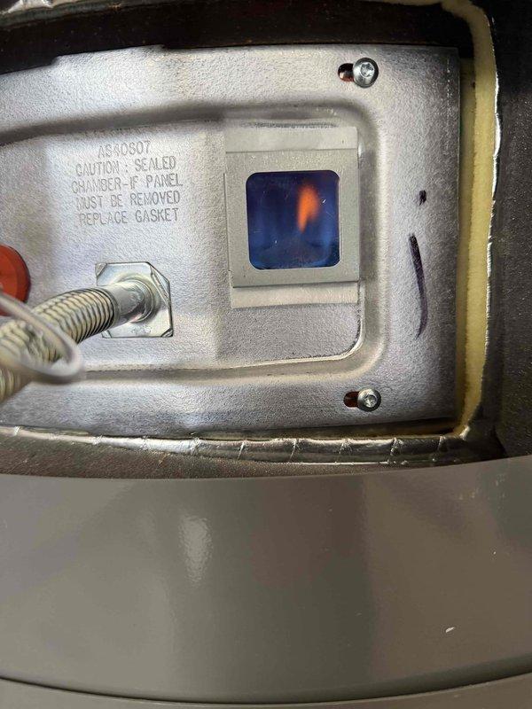 Successfully installed a 75-gallon Rheem Professional water heater under warranty. Completed full setup including copper piping connections, expansion tank mounting, and valve installations. Verified proper operation with flame inspection through viewing window.