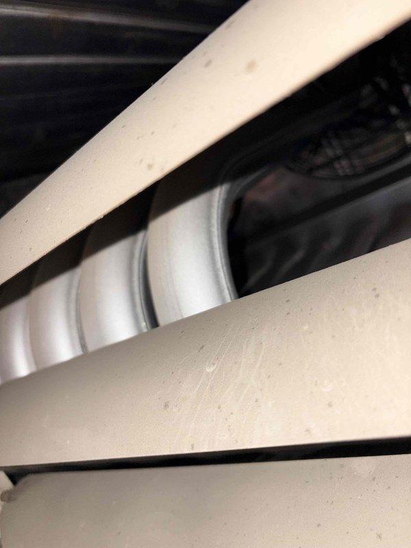 Performed comprehensive commercial maintenance service on hanging heaters and furnace system. Inspected and documented condition of motor run capacitor showing signs of dirt accumulation and wear. Installed new 20x25x1 filter and completed standard cleaning procedures on all equipment components per maintenance protocol.