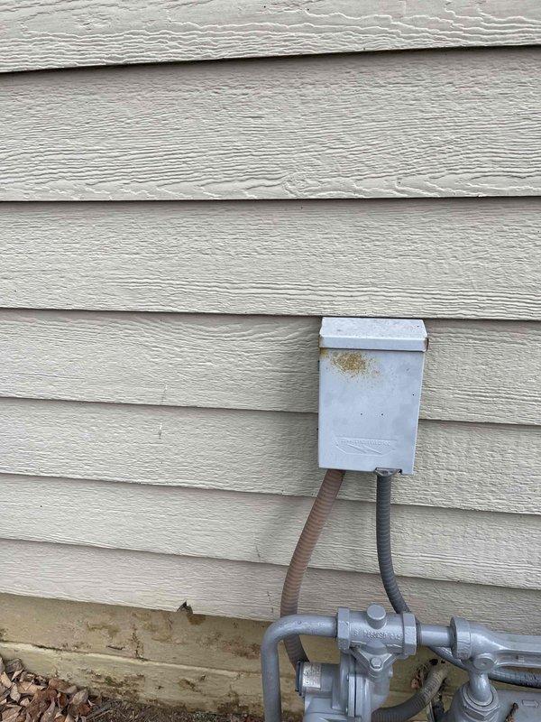 Completed free estimate for furnace replacement and evaluated existing HVAC system. Inspected exterior components including weathered outdoor AC unit on concrete pad with associated electrical connections and disconnect box. Noted current installation condition of utility connections and gas meter/regulator assembly mounted to exterior siding.