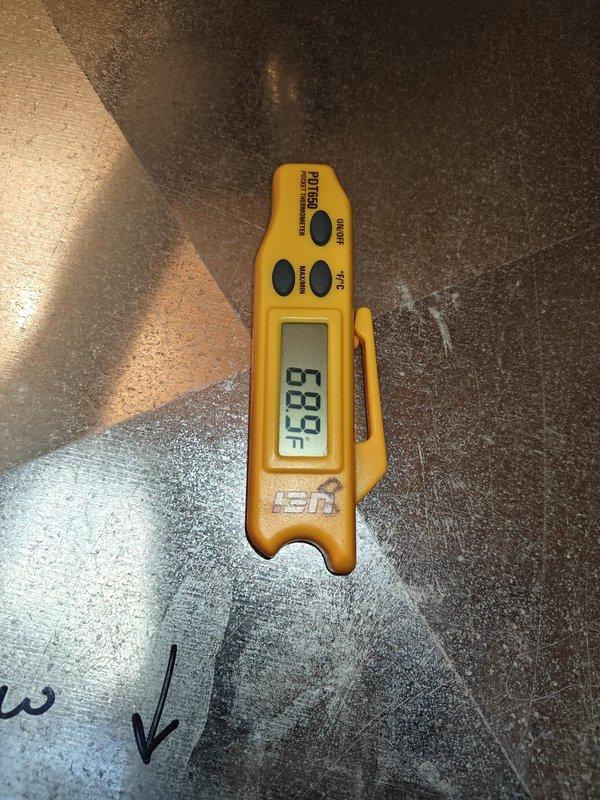 Performed heating maintenance service including system diagnostic testing with readings of 63.7 on temperature differential. Inspected control board circuitry and verified proper operation of electronic components, noting normal function of the digital display (23H) and all connection points. All colored wiring harnesses were examined and confirmed to be properly secured with no signs of wear or damage.